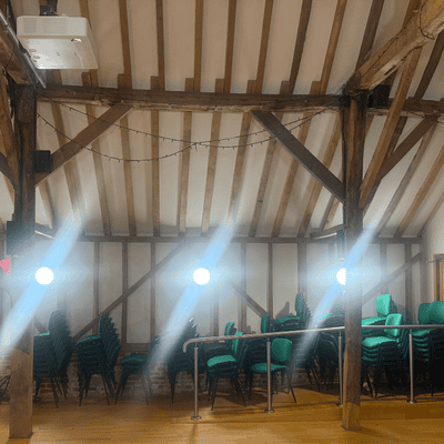 Three new round LED wall lights glowing inside Hanger Farm, with starburst patterns radiating from each light.
